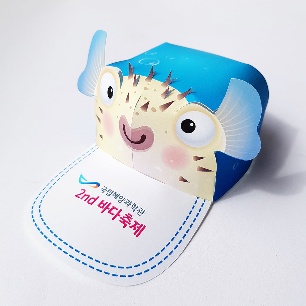 Custom pop-up event cap with pufferfish character design